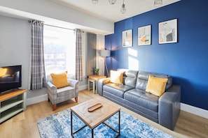 TV, fireplace, books, offices
