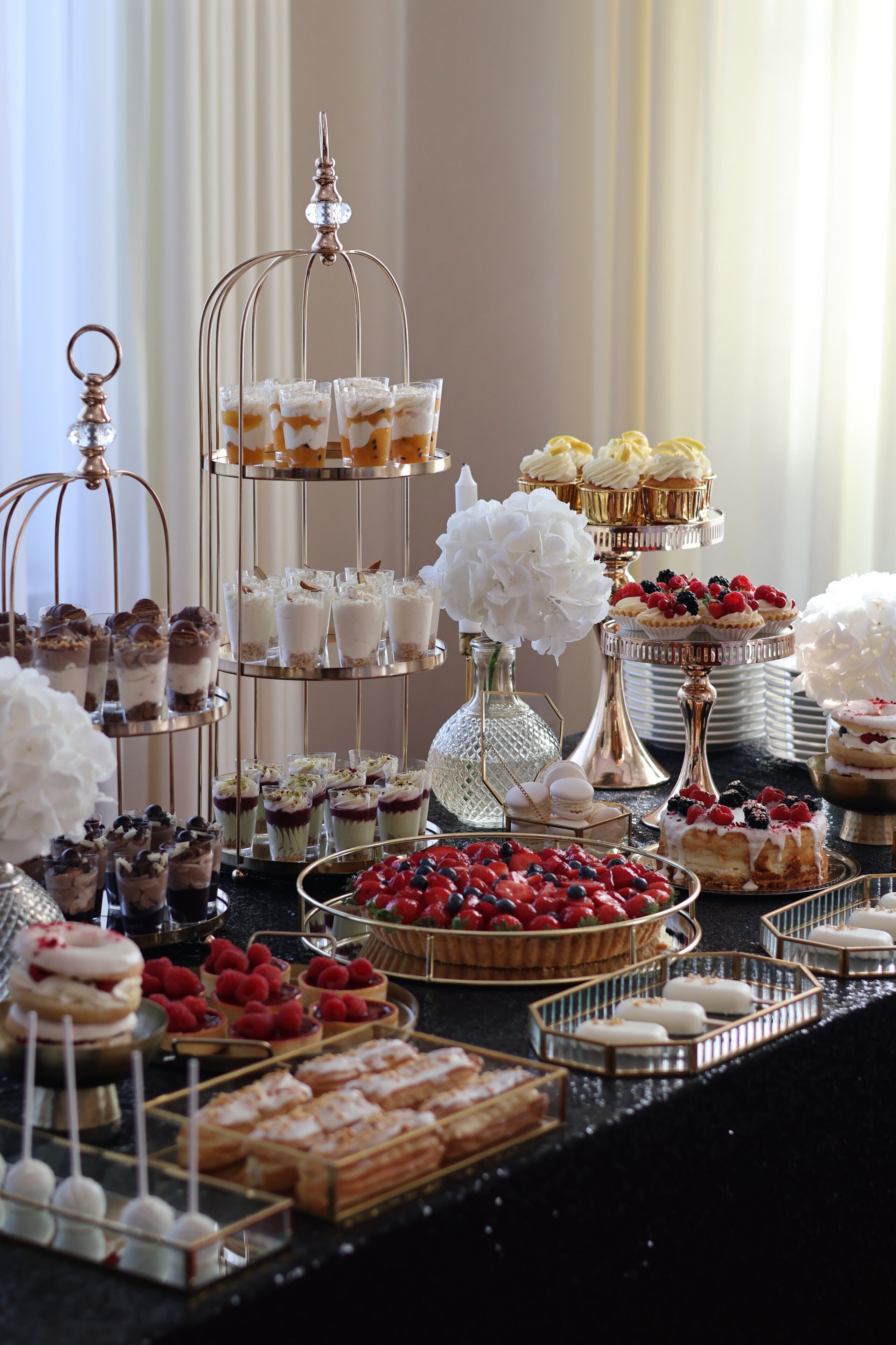 A dessert buffet with various sweet treats and pastries.