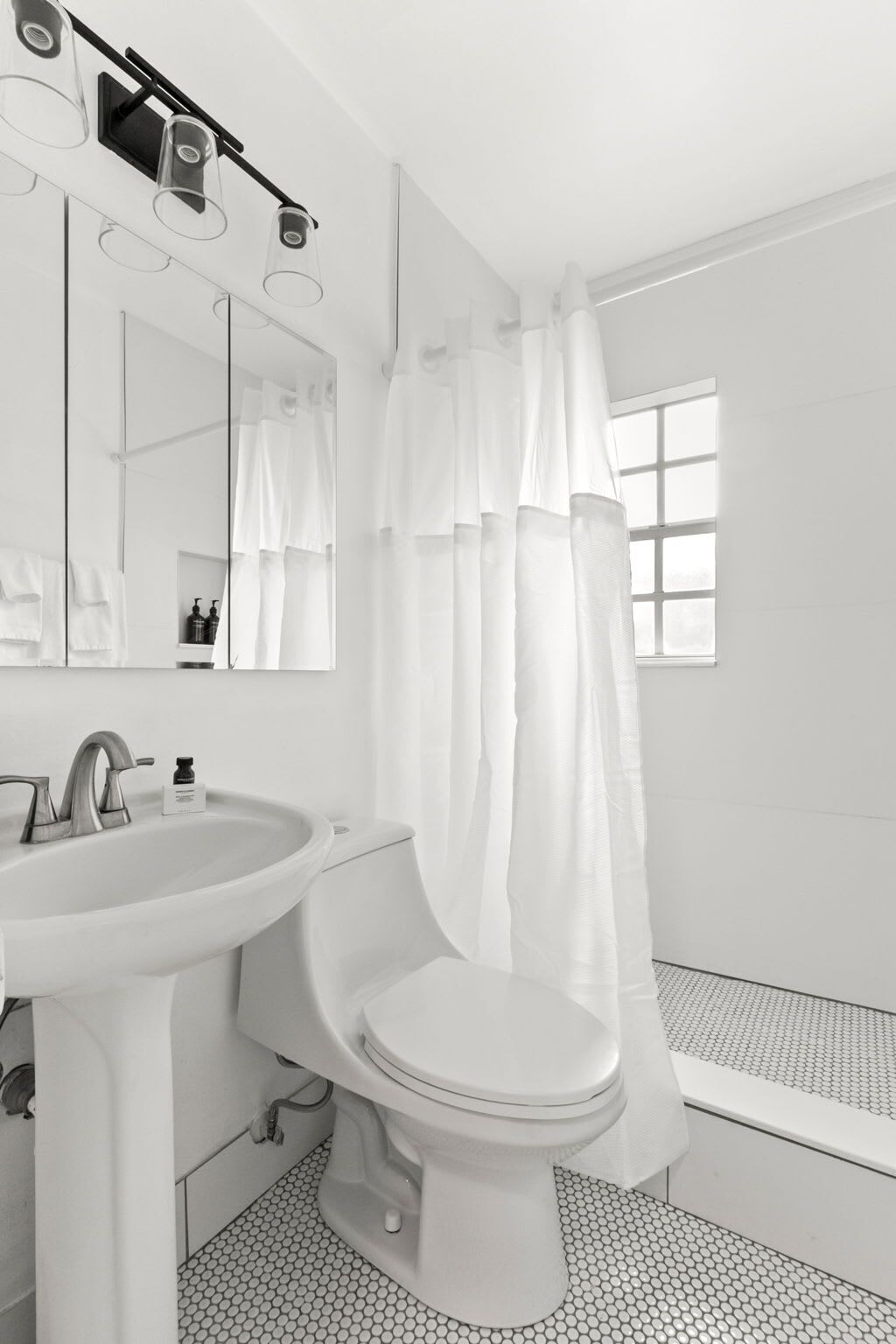 Shower, hair dryer, towels, shampoo