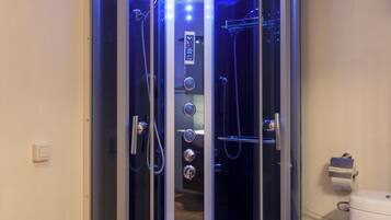 Shower, hair dryer, towels, soap
