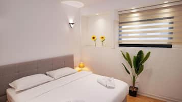 Deluxe kamer, 1 twee- of 2 eenpersoonsbedden | Luxe beddengoed, babybedden (toeslag), gratis wifi, beddengoed