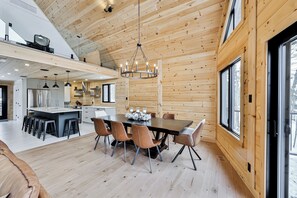 Cozy cabin with a spacious dining area and modern kitchen.