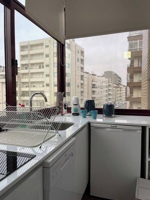 Fridge, microwave, dishwasher, coffee/tea maker