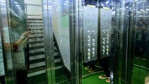 An elevator with a control panel and emergency equipment. - Hotel Aaarav Grand - Mathura Vrindavan (Mathura)