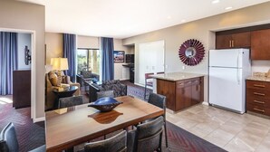 A modern hotel room with a dining area, kitchen, and living space. - Worldmark Indio Resort/Coachella Week1/2BDR/Sleeps 6 (Indio)