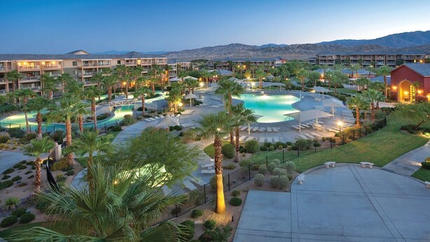 A resort with multiple swimming pools, palm trees, and a mountainous backdrop. - Worldmark Indio Resort/Coachella Week1/2BDR/Sleeps 6 (Indio)