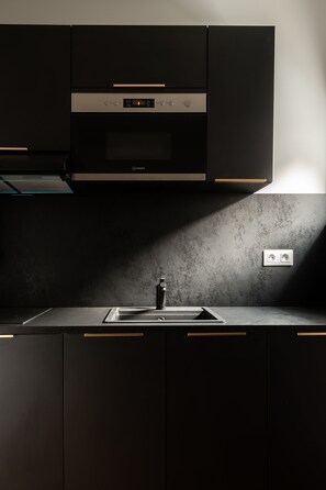 Chambre Deluxe double, salle de bain privée | Cuisine partagée