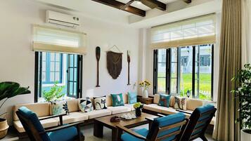 Luxury Villa, 3 Bedrooms, Balcony, Garden View | Living area | 65-inch LED TV with cable channels, streaming services