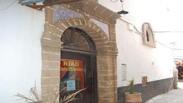 A building with a tiled archway and a sign that reads "Riad." - RIAD in the heart of the medina, 3 minutes from the beach (Essaouira)