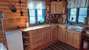 Fridge, stovetop, cookware/dishes/utensils, dining tables
