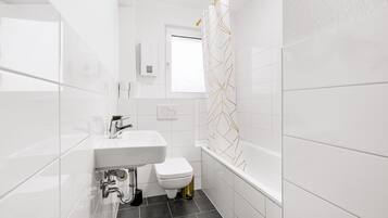 Hair dryer, towels, soap, shampoo
