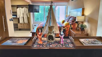 1 bedroom, desk, iron/ironing board, travel crib