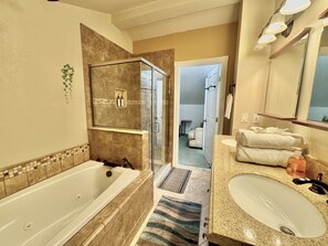 Jetted tub, hair dryer, towels, soap