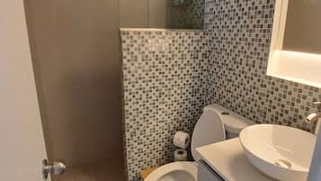 Shower, towels, soap, toilet paper
