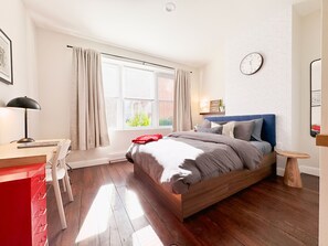 1 bedroom, desk, iron/ironing board, travel crib