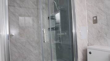 Shower, eco-friendly toiletries, towels, soap