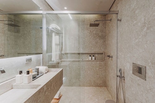 Shower, eco-friendly toiletries, hair dryer, towels