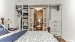 A bedroom with a bed, a wardrobe, and a walk-in closet. - Pet-Friendly Apt  Fenced yard  Private Parking (Allentown)