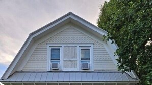 A two-story house with a porch, large windows, and a small front yard. - 162 Peach Perfectly Located inside Lakeside! (Lakeside)