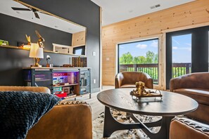 Smart TV, fireplace, video games, foosball - Lakefront home with retro accents, private pool, and private dock. (Sevierville)