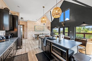 Fridge, microwave, oven, stovetop - Lakefront home with retro accents, private pool, and private dock. (Sevierville)