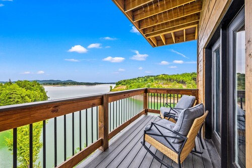 Lakefront home with retro accents, private pool, and private dock.