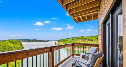 Lakefront home with retro accents, private pool, and private dock.