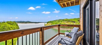 Lakefront home with retro accents, private pool, and private dock.