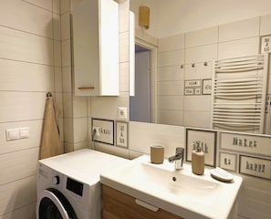 Shower, free toiletries, hair dryer, slippers
