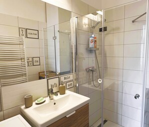 Shower, free toiletries, hair dryer, slippers