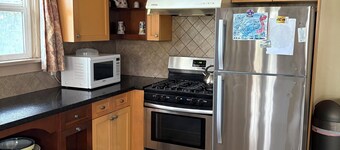 Older 3 bedroom home, fully furnished, two minutes to Marine gateway skytrain