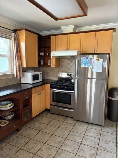 Older 3 bedroom home, fully furnished, two minutes to Marine gateway skytrain