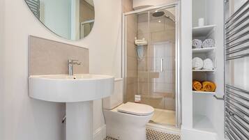 Shower, hair dryer, towels, soap