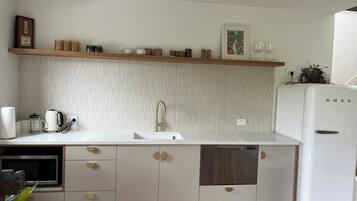 Fridge, microwave, dishwasher, coffee/tea maker