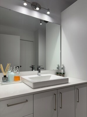 Shower, towels, soap, toilet paper