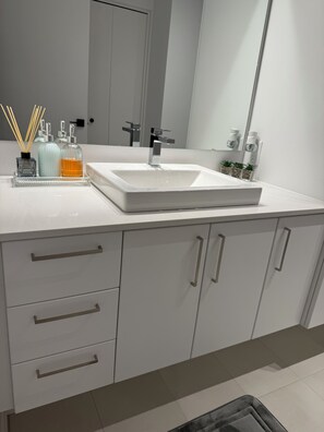 Shower, towels, soap, toilet paper