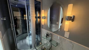 Shower, hair dryer, towels, soap