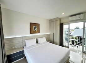 Roupas de cama premium, frigobar, cortinas blackout, Wi-Fi de cortesia