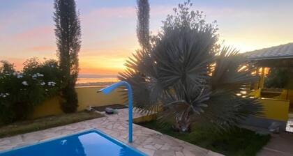 House with heated pool for up to 16 people close to the beach.