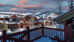 A snow-covered mountain town with wooden buildings and a wooden deck. - 8 Mins to Trails | Near Shuttle (Winter Park)