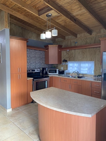 Private kitchen. Charming 2-bedroom house in awesome Quebradillas with AC, WiFi