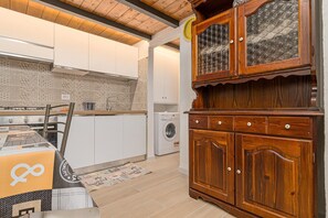 Fridge, coffee/tea maker, cookware/dishes/utensils