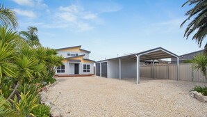 A two-story house with a covered garage and a gravel driveway. - The Pit Stop Tailem Bend (Tailem Bend)