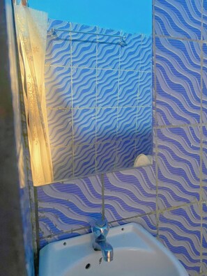 Bidet, towels, soap, toilet paper