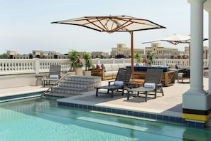 Outdoor pool, pool umbrellas, sun loungers