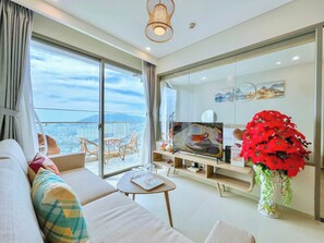 Comfort Apartment, Balcony, City View | Living area | 30-inch TV with cable channels