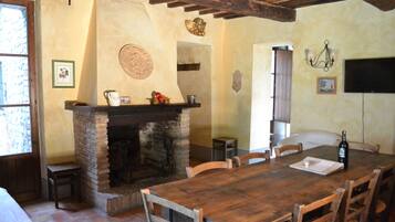 Apartment, Hill View | Living area | 32-inch flat-screen TV with cable channels