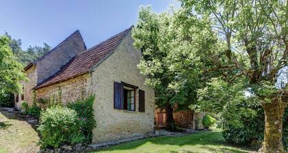 House with a large garden surrounded by nature