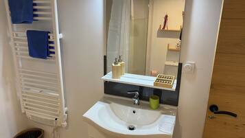 Shower, towels, soap, toilet paper