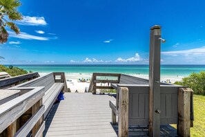A wooden boardwalk leading to a beach with clear turquoise water and a few people in the distance. - Gulf Front, 2 BR/ 2 BA Private Beach Access Pool & Bikes (Seagrove Beach)